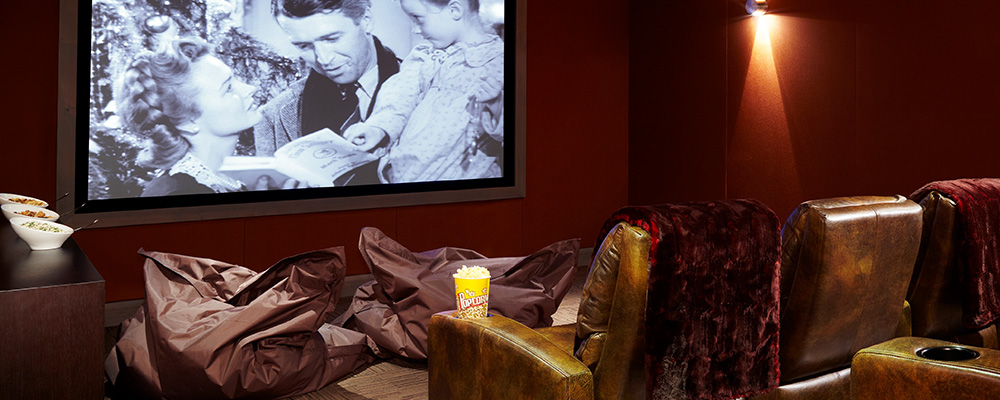 A private theater plays a film for members of an Aspen fractional ownership program.