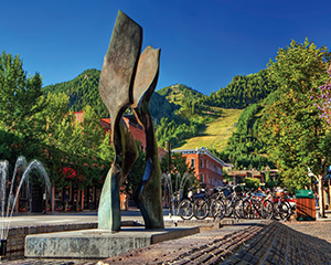 A modern sculpture in downtown Aspen stands under a clear blue sky.